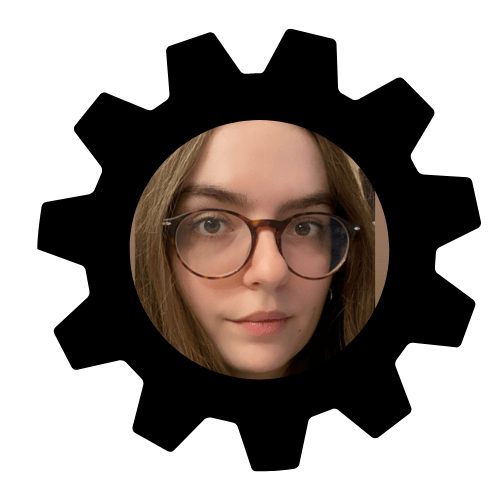 A woman's face framed by a gear shape, featuring brown hair and glasses.
